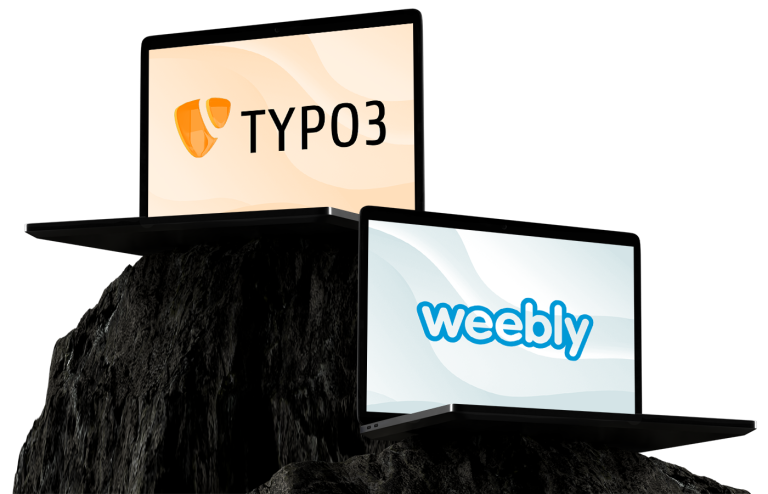 Zwei offene Laptops – vorderer Laptop zeigt Schriftzug 'weebly', hinterer Laptop zeigt Schriftzug 'TYPO3' – beide mit schwarzen Gehäusen leicht versetzt auf dunklen, rauen Felsblöcken platziert, helle Bildschirmhintergründe.